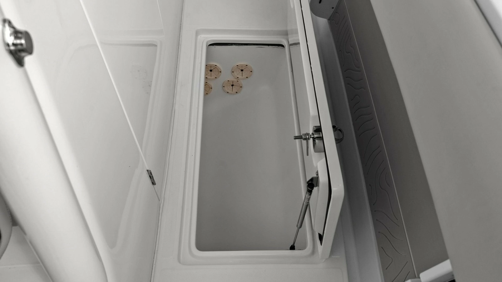 Spacious In-Deck Storage Compartment