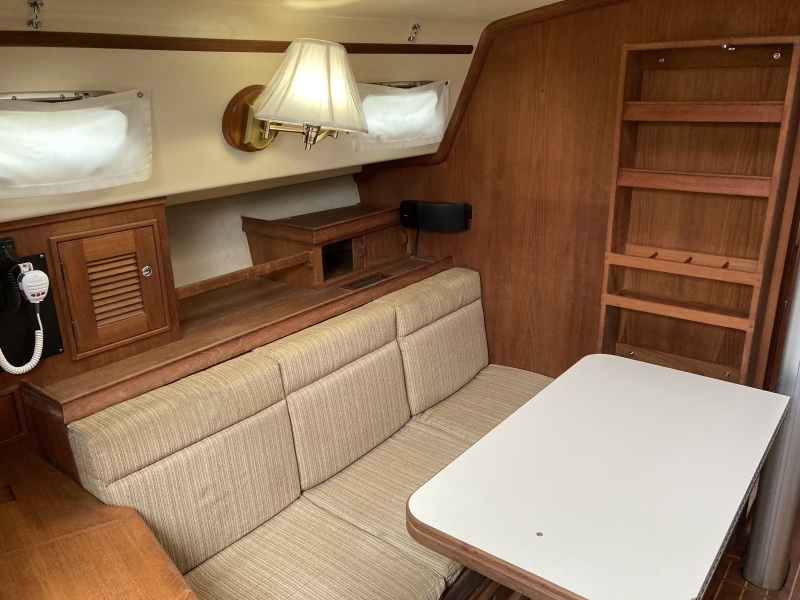 Port settee showing storage on bulkhead