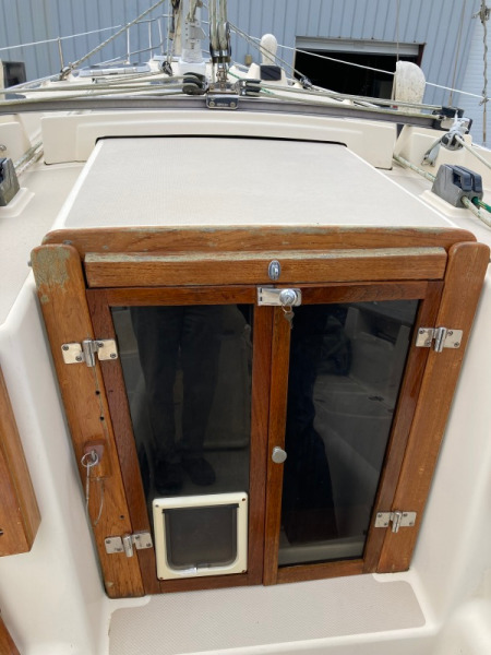 Hinged doors or hatch boards