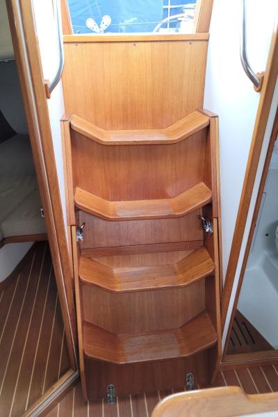 Harlequin companionway ladder and engine cowling.