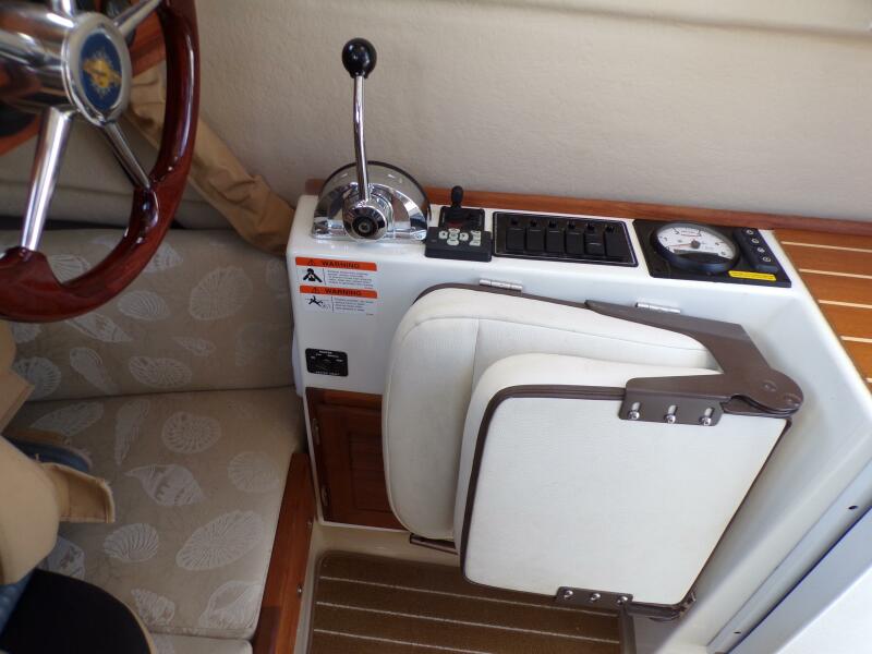 Miss Baker 2017 Ranger Tugs R-21EC capt chair folded
