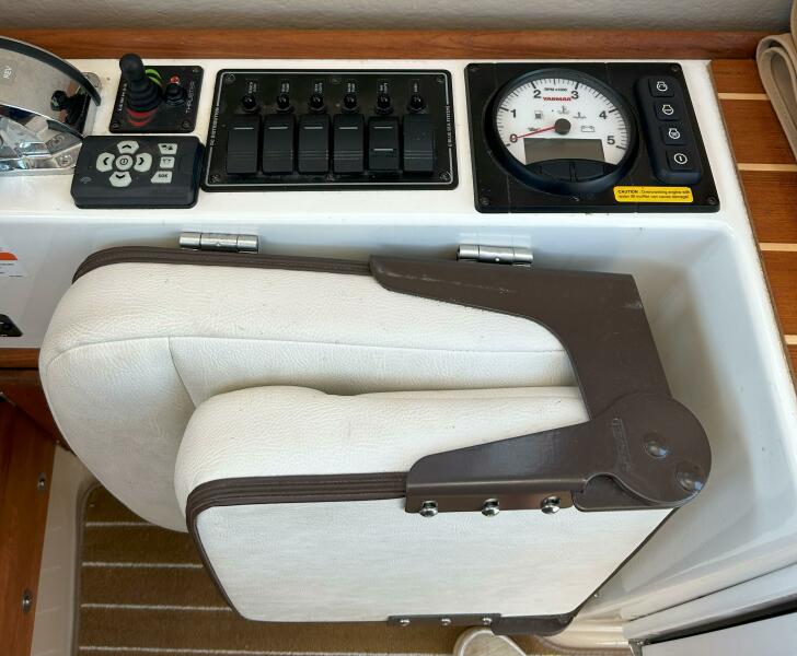 Miss Baker 2017 Ranger Tugs R-21EC captain chair folded