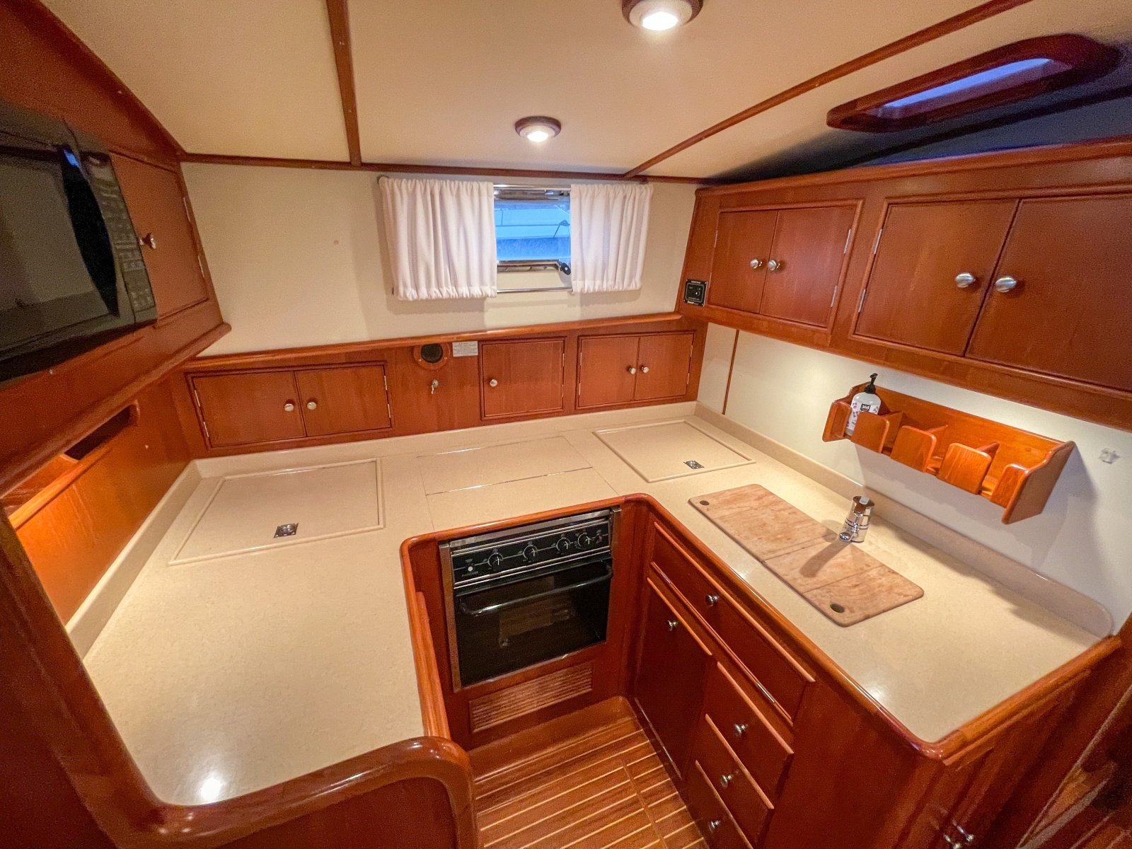 2001 Grand Banks Eastbay 38HX galley fridge, stove and basin
