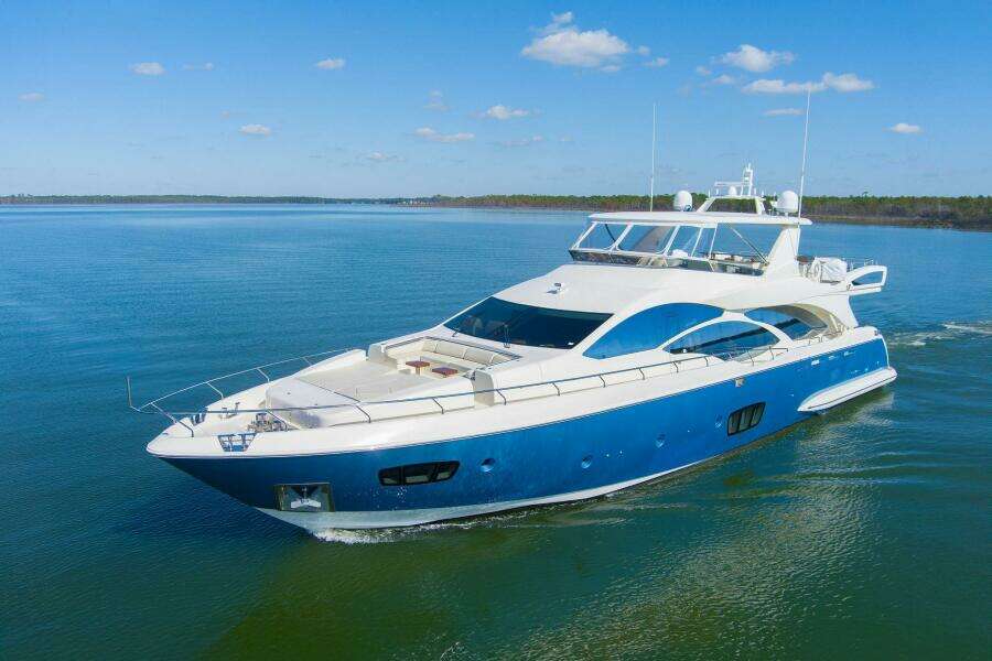 Azimut 2013 motor yacht cruising on calm blue waters under a clear sky
