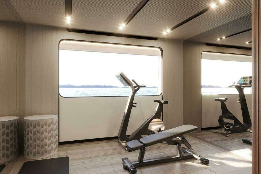 Luxury yacht gym interior with exercise bikes and bench, Majesty 145, 2026 model.