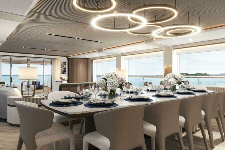 Luxurious dining area on 2026 Majesty 145 yacht with elegant decor and ocean views.