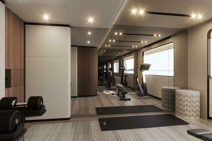 Luxurious gym interior on 2026 Majesty 145 yacht, featuring modern equipment and elegant design.