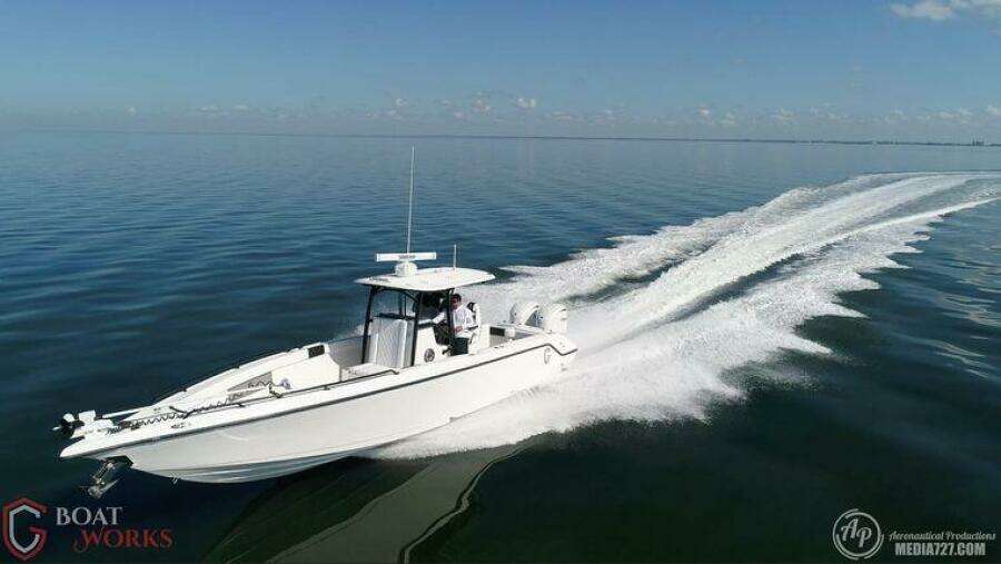 A 2022 CG Boat Works 35 M-Series cruising on calm waters.