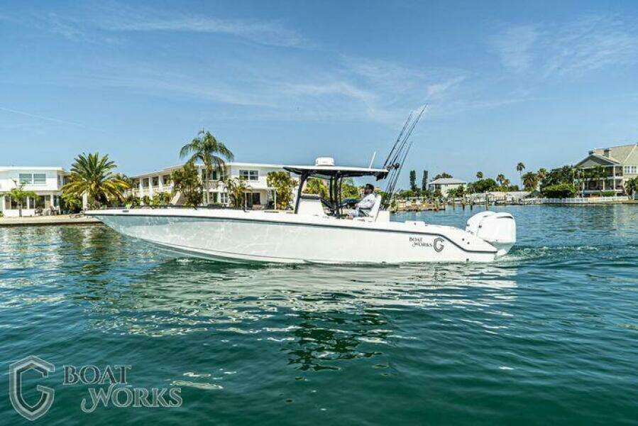 2022 CG Boat Works 35 M-Series cruising on a sunny waterfront.