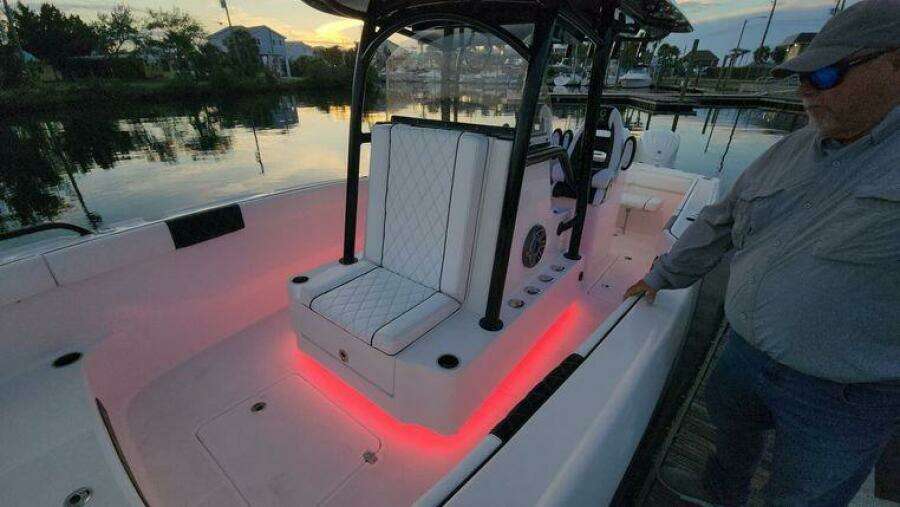 2022 CG Boat Works 35 M-Series with illuminated seating and console at sunset.