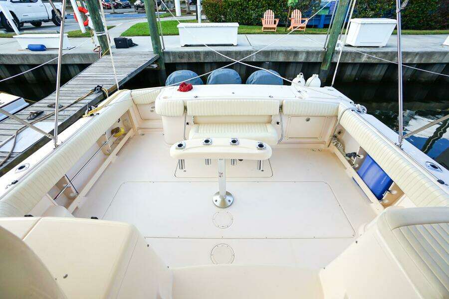 2007 Grady-White Express 360 boat interior with seating and table, docked at marina.