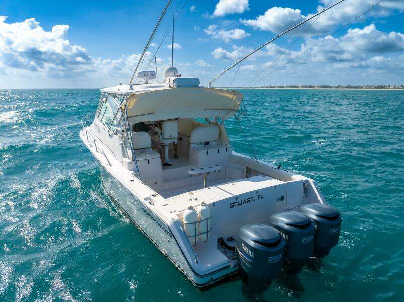 2007 Grady-White Express 360 boat on open sea under a clear blue sky.