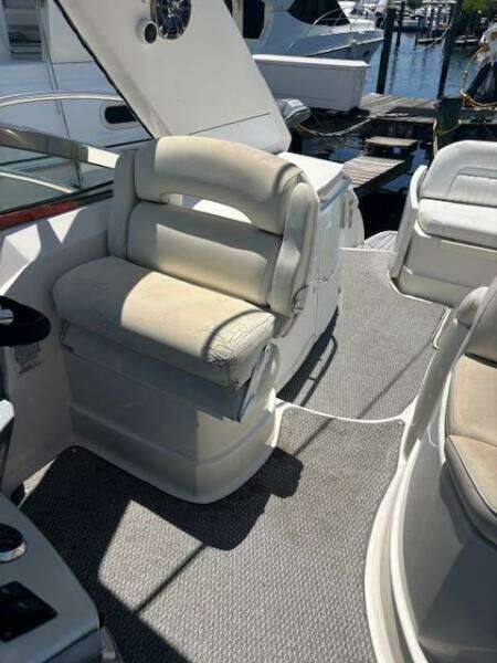 2007 Monterey 350 Sport Yacht interior with white seating and docked at marina.