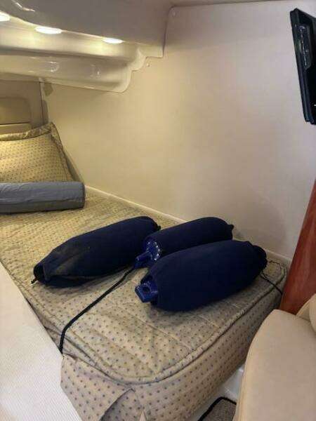 Interior of 2007 Monterey 350 Sport Yacht with beige leather seating and porthole window.