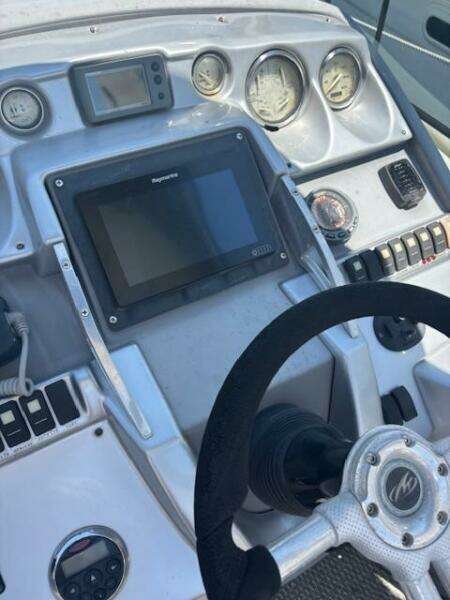 Control panel of a 2007 Monterey 350 Sport Yacht with radio and switches.