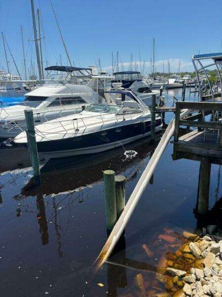 2007 Monterey 350 Sport Yacht docked in marina, surrounded by other boats.
