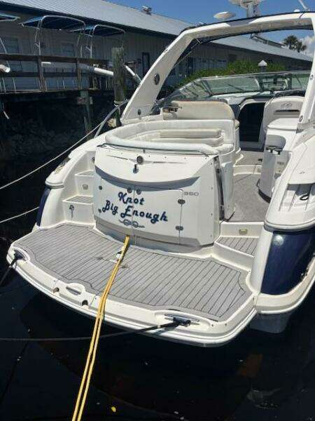 2007 Monterey 350 Sport Yacht docked beside wooden pier in marina.