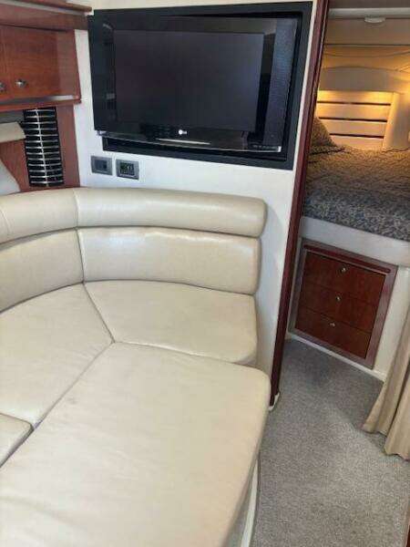 Interior seating of 2007 Monterey 350 Sport Yacht with beige leather upholstery.