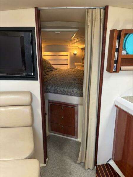 Interior of 2007 Monterey 350 Sport Yacht with leather seating and flat-screen TV.
