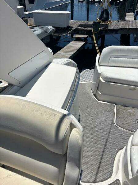 Interior view of a 2007 Monterey 350 Sport Yacht with wooden steps and cozy cabin.
