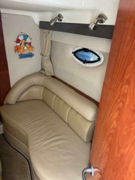 Interior of 2007 Monterey 350 Sport Yacht with beige seating and nautical decor.