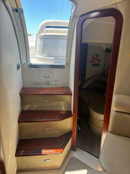 Interior of 2007 Monterey 350 Sport Yacht with cozy bedroom and modern amenities.
