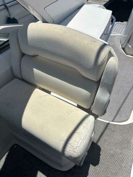 2007 Monterey 350 Sport Yacht interior with white seating and dock view.