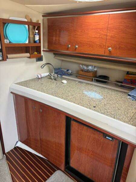 2007 Monterey 350 Sport Yacht cabin interior with cozy bedding and ambient lighting.