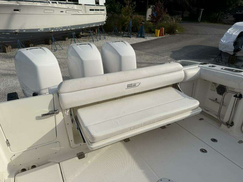 2014 Boston Whaler 350 Outrage cockpit with rear bench seat open, looking from starboard side