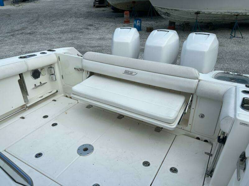 2014 Boston Whaler 350 Outrage cockpit with rear bench seat open, looking from port side
