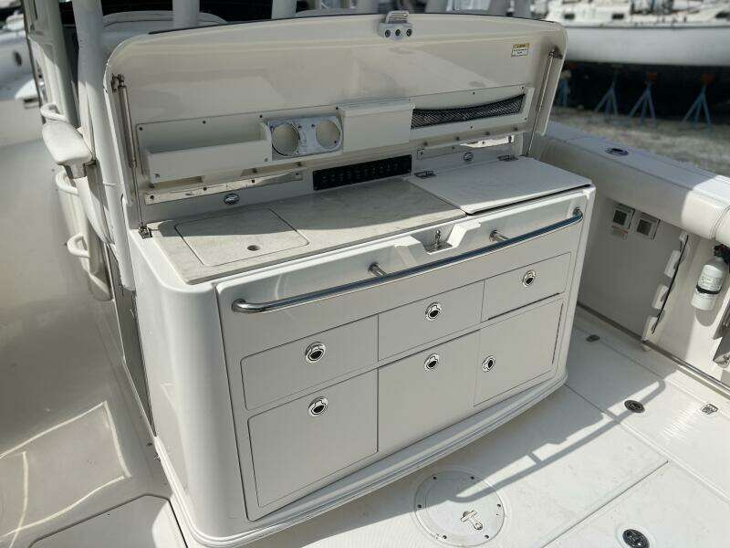 2014 Boston Whaler 350 Outrage Summer Kitchen Leaning Post open, looking from port side