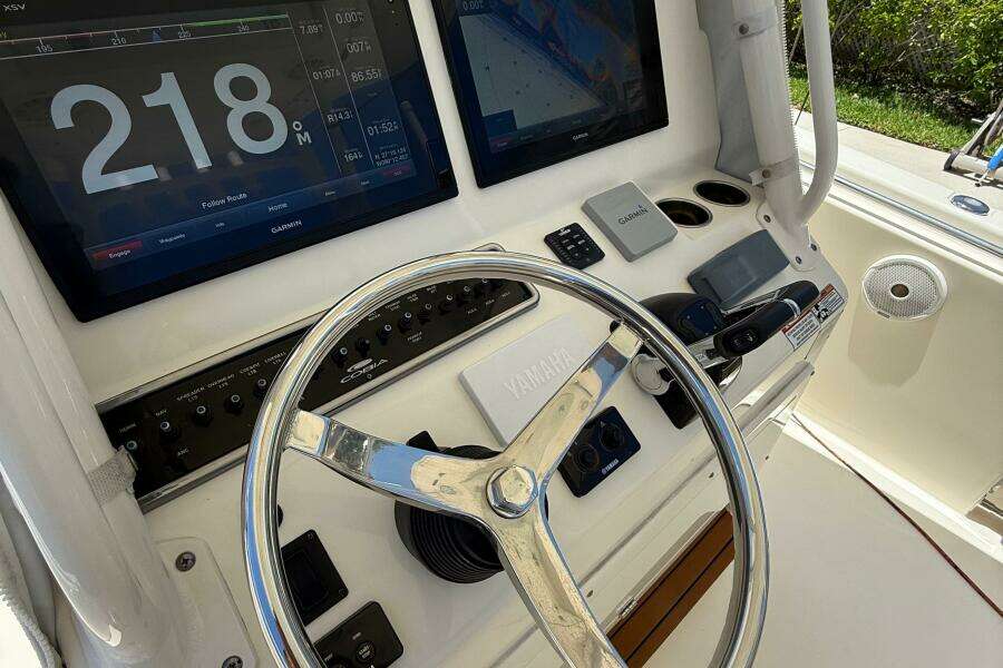 2015 Cobia 296 Center Console helm with Garmin displays and Yamaha steering wheel.