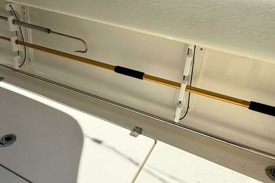 2015 Cobia 296 Center Console boat interior with fishing rod holder.