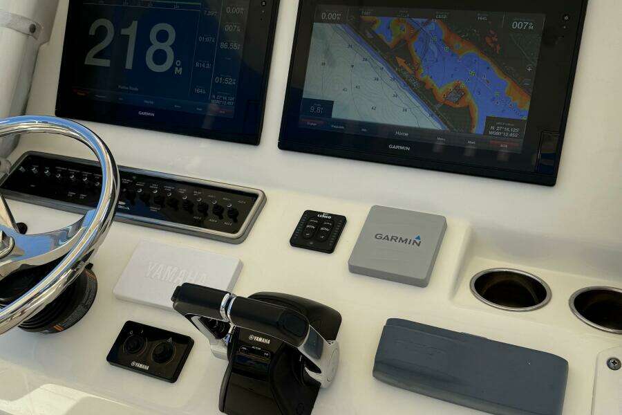 2015 Cobia 296 Center Console dashboard with Garmin navigation displays and Yamaha controls.