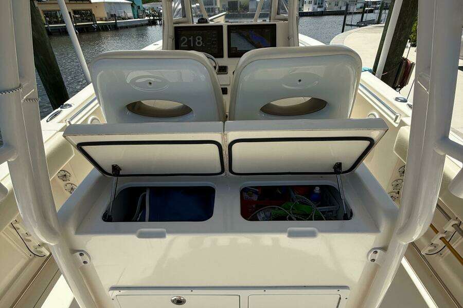 2015 Cobia 296 Center Console boat interior with open storage compartments.