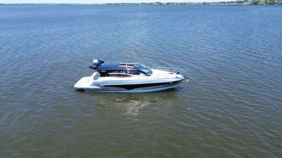 2025 Real 40 HT Luxury yacht cruising on open water.