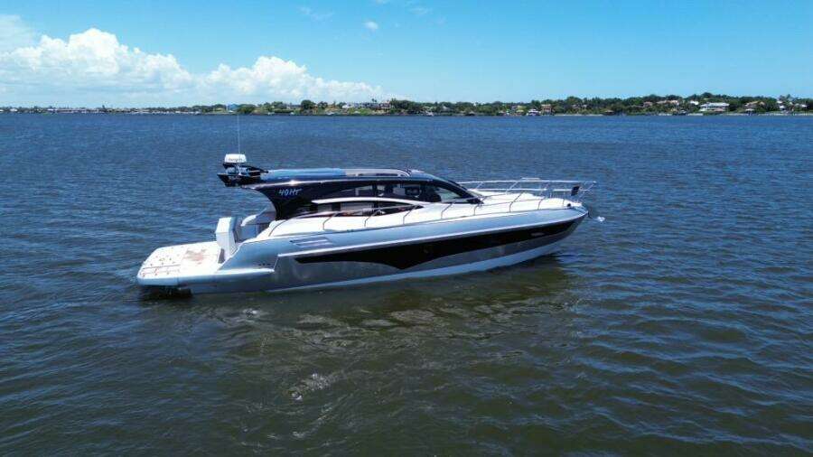 2025 Real 40 HT Luxury yacht cruising on a sunny day.