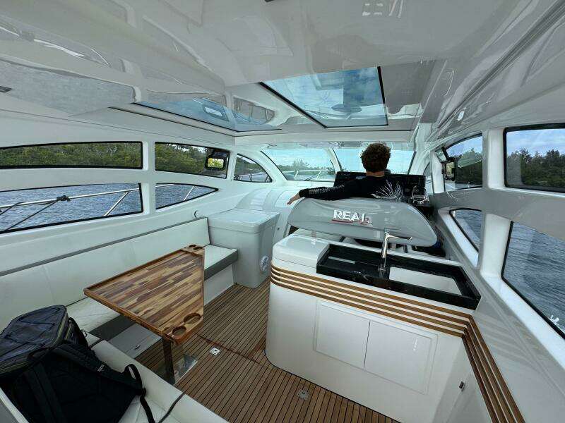 Luxurious interior of 2025 Real 40 HT yacht with modern design and panoramic windows.