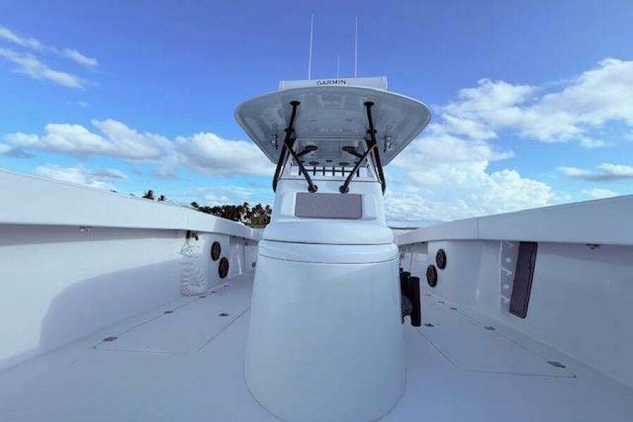 2019 Freeman 34 boat with Garmin equipment, clear sky, and ocean view.