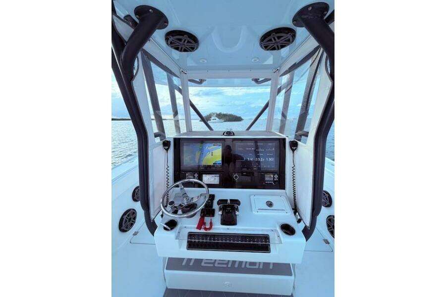 Freeman 34 boat cockpit with navigation screens and steering wheel, 2019 model.