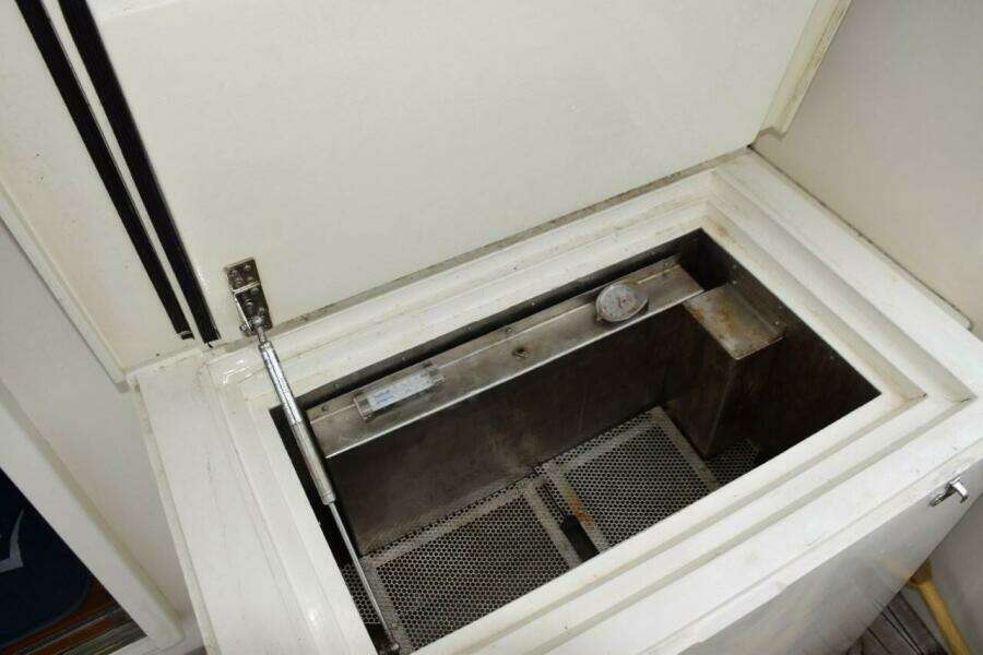 Stainless steel lined cockpit freezer