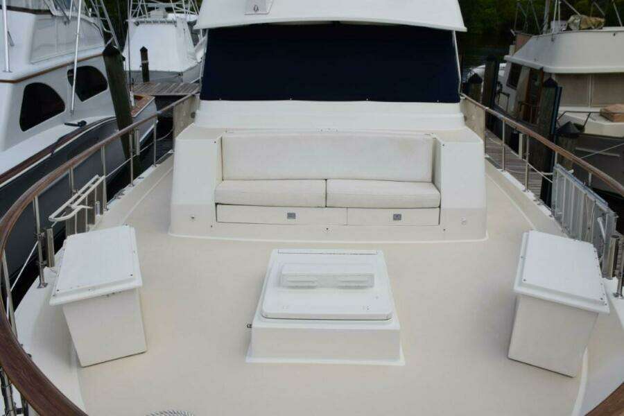 Foredeck lounge seat and two dunnage storage boxes which also have cushion tops