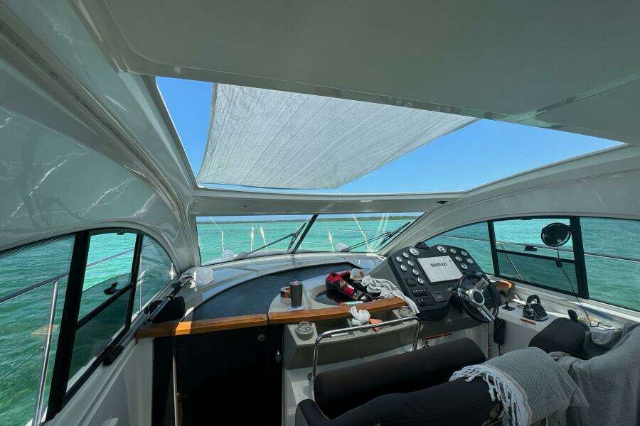 Interior view of 2014 Beneteau Gran Turismo 44 yacht cockpit with ocean backdrop.