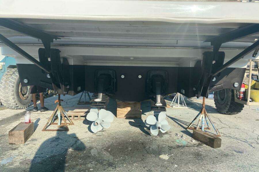 Rear view of 2014 Beneteau Gran Turismo 44 boat on stands, showing dual propellers.