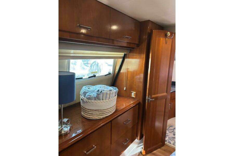 Interior of 2004 Carver 466 Motor Yacht with wooden cabinets and window. Interior of 2004 Carver 466 Motor Yacht with wooden cabinets and window.