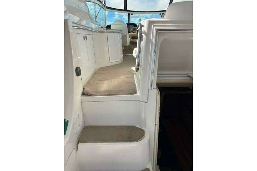 Interior view of 2004 Carver 466 Motor Yacht, featuring carpeted steps and sleek design. Interior view of 2004 Carver 466 Motor Yacht, featuring carpeted steps and sleek design.