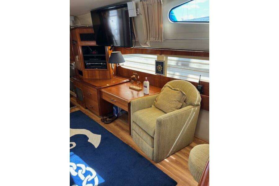 Interior of 2004 Carver 466 Motor Yacht with cozy seating and entertainment area. Interior of 2004 Carver 466 Motor Yacht with cozy seating and entertainment area.
