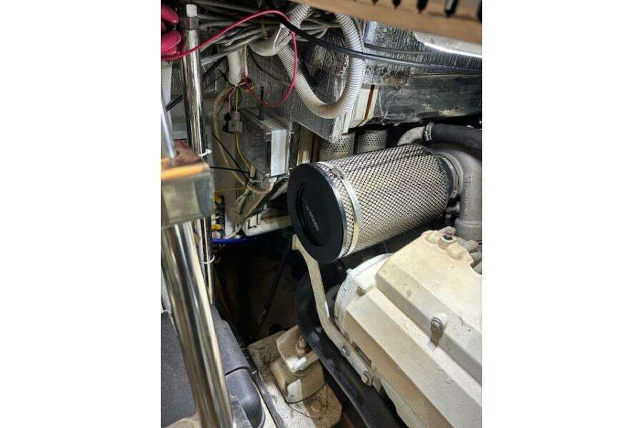 Engine room of 2004 Carver 466 Motor Yacht, showcasing mechanical components and wiring. Engine room of 2004 Carver 466 Motor Yacht, showcasing mechanical components and wiring.