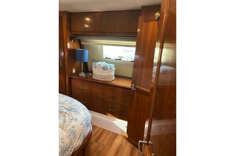 Interior of 2004 Carver 466 Motor Yacht with wooden cabinetry and cozy decor. Interior of 2004 Carver 466 Motor Yacht with wooden cabinetry and cozy decor.