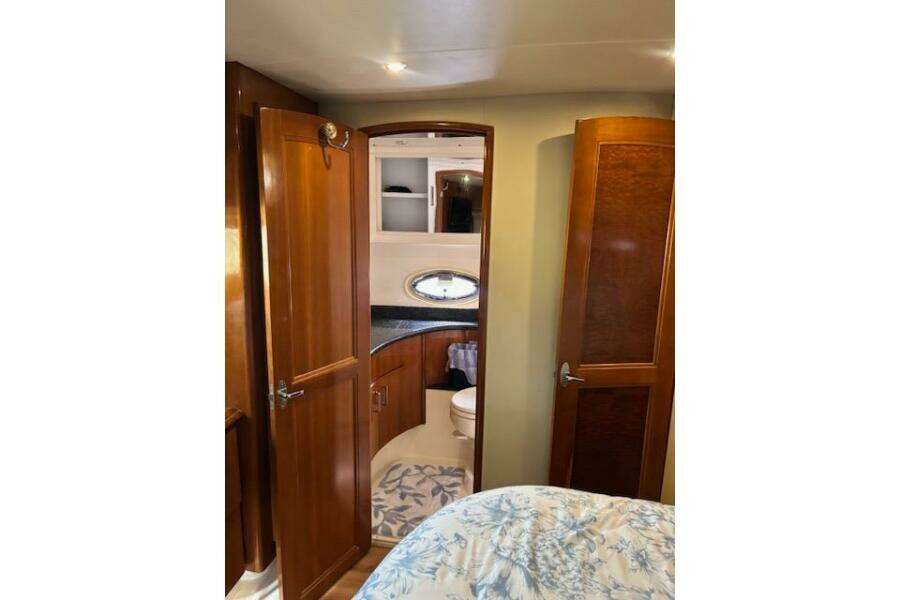 Interior of 2004 Carver 466 Motor Yacht with wooden cabinetry and bathroom view. Interior of 2004 Carver 466 Motor Yacht with wooden cabinetry and bathroom view.